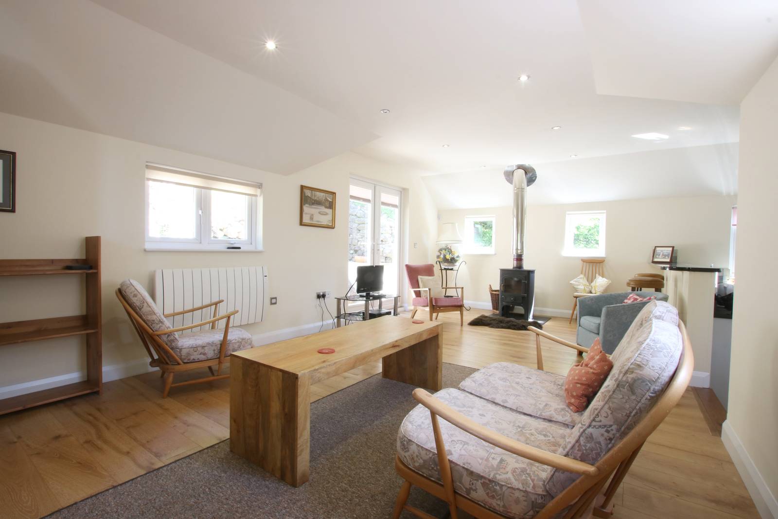 image shows: The spacious lounge/dining room has a lovely light and airy feel