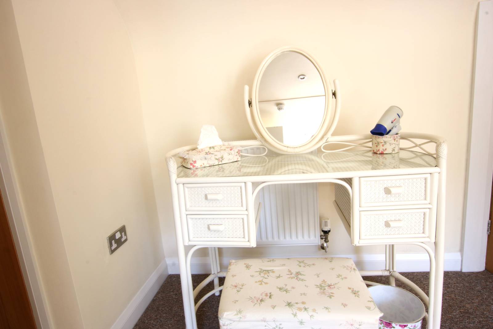 image shows: There is plenty of room and light in the hallway to sit quietly or get ready for the day